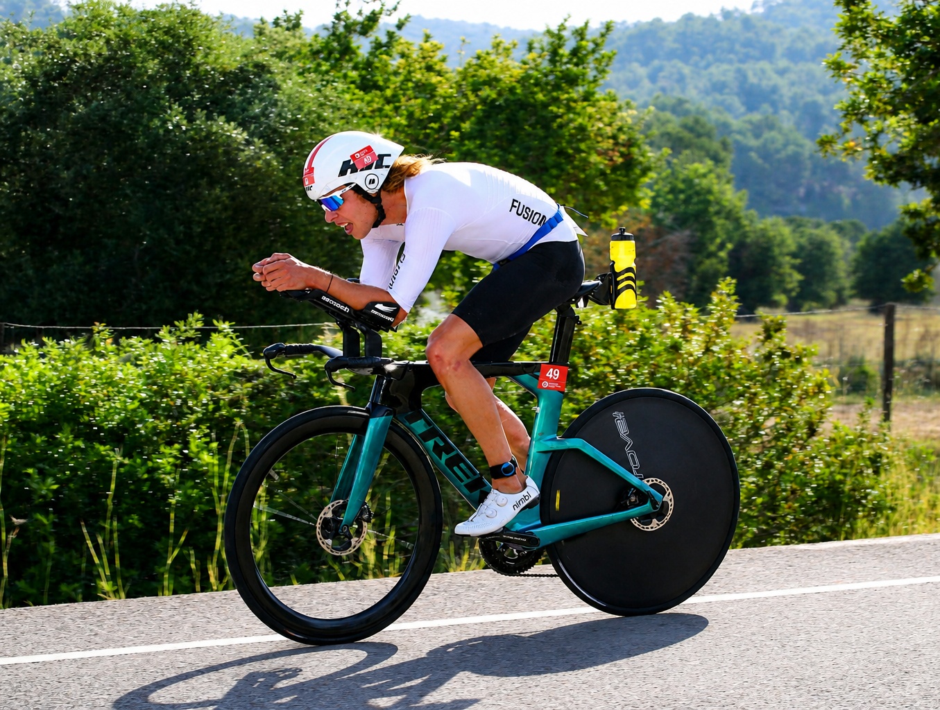 Blair Loggie riding a triathlon bike during a race